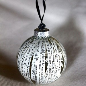 Glass ball ornament filled with cut book pages