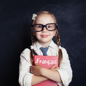 Girl holding french language book