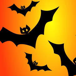 Bats flying against an orange sky