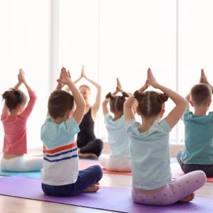 children sitting and doing yoga