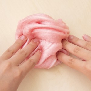 pink oobleck in a child's hands