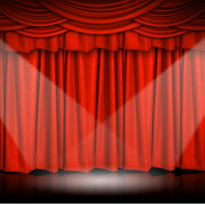Red curtain behind stage with two spotlights