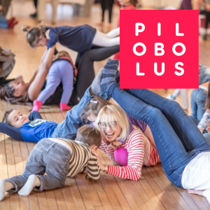 Photo of families building letters with their bodies and Pilobolus logo