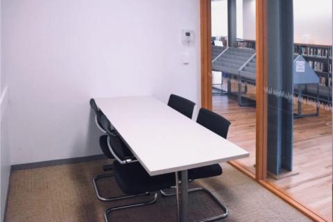 Study room with rectangular table and four chairs