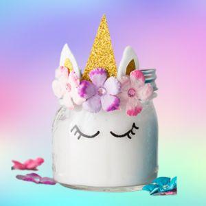 Jar of slime decorated like unicorn on rainbow background