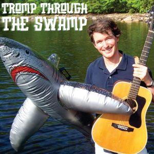 Photo of Tom Sieling with guitar and inflatable shark