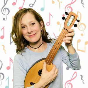 Photo of Julie Stepanek playing ukulele