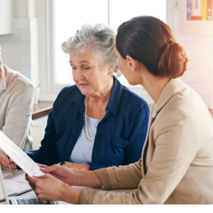 Financial Advisor Helping Elderly Client