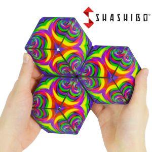 Photograph of hands holding open Shashibo Cube with Shashibo logo