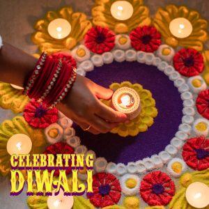 Photo of mandala and diya with text "celebrate diwali"