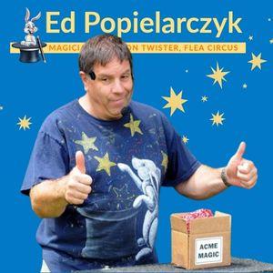 Photo of Ed Pop Magic performing with logo