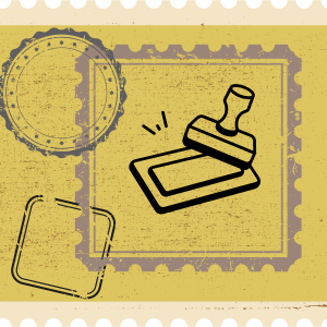 Stamp pad and ink with stamps in the background