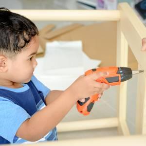 Child drilling into wood