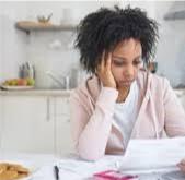 Photo of a woman paying bills