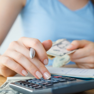 Image of Woman Using a Calculator