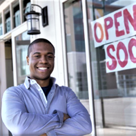 Man Outside His New Store