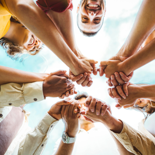 Circle of people uniting hands