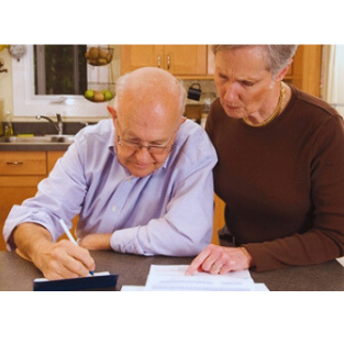 Caregiver Helping Person with Dementia with Finances