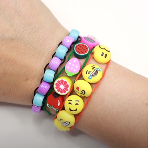 A wrist wearing several bracelets with fidget-able beads