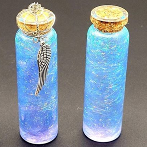 Two bottles of blue and purple mystical liquid.