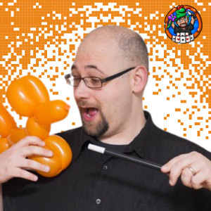 Photo of Matt Mathews with magic wand and balloon animal