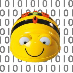 Photo of bee bot robot with code in background